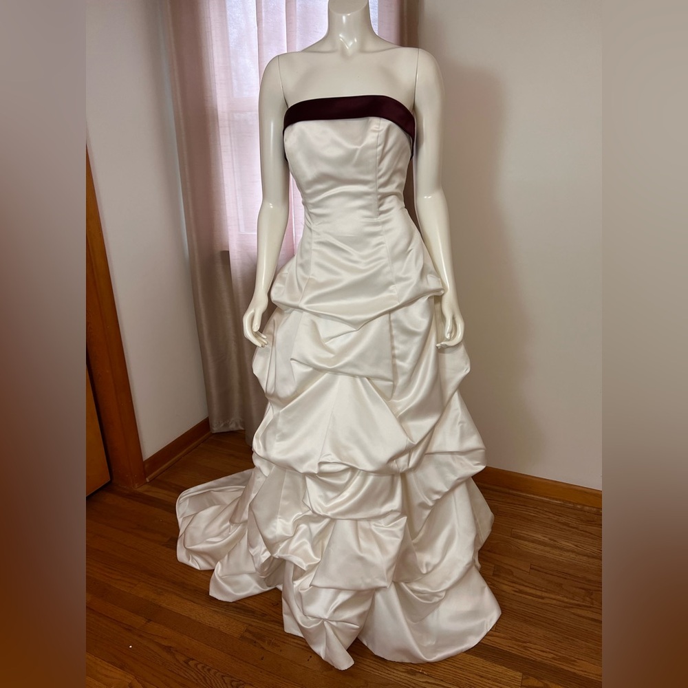 Elegant Strapless White / wine corset back wedding gown.